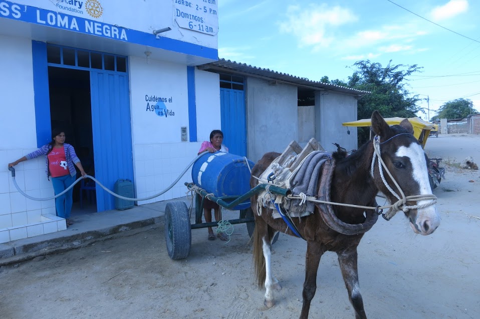 Citizens of Loma Negra deliver safe water to their neighbors.