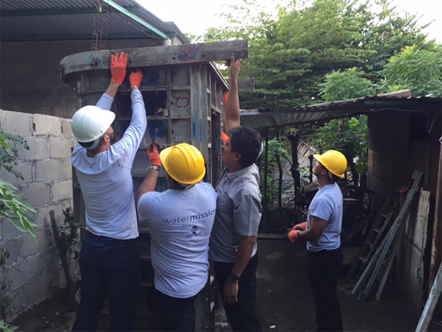 Jaime helps to build a latrine.