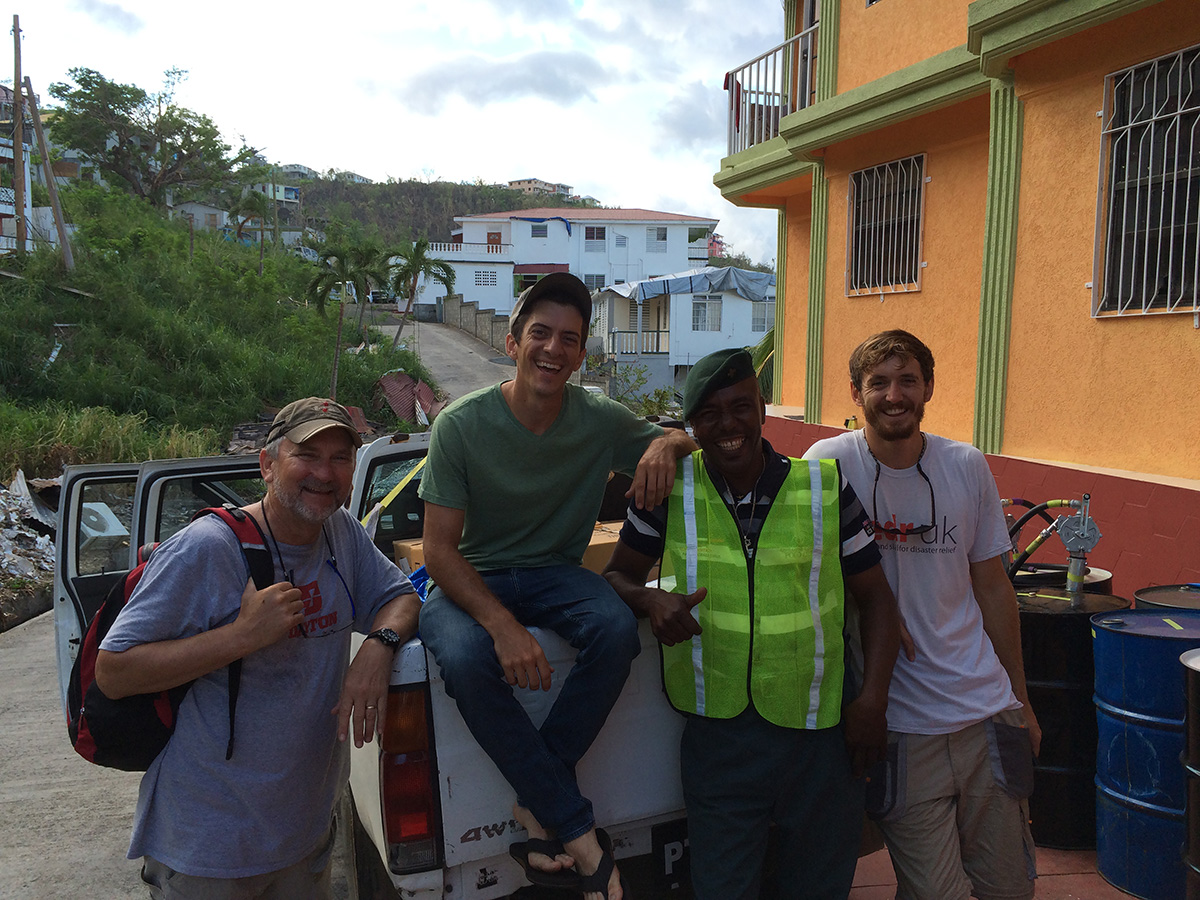 Water Mission engineer, Nick Mason, poses for a photo with some of the disaster response team.