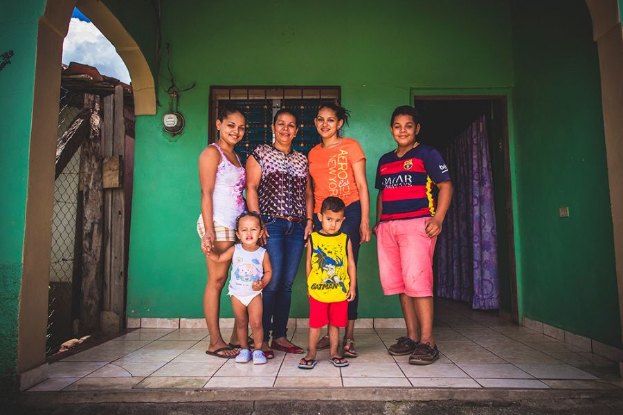 Ubelia Escobar with her three children and two grandchildren, who now have financial peace because of safe water.