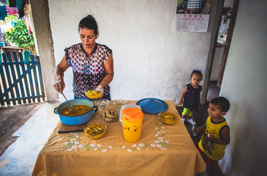 Ubelia prepares dinner for her family.