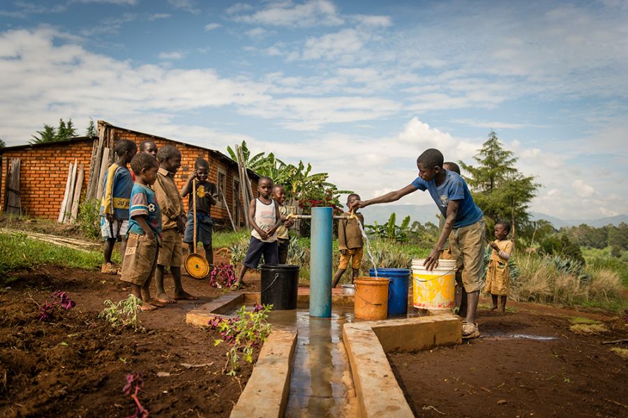 Children draw water in Tanzania.