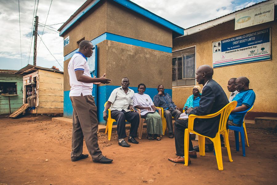 A group of active community members in Uganda discusses their water system.