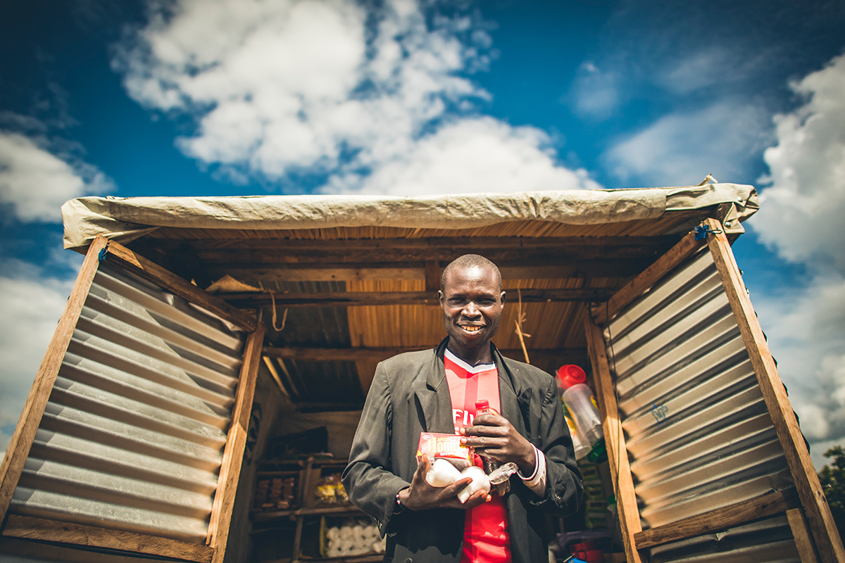 Dada Angelo in front of his shop