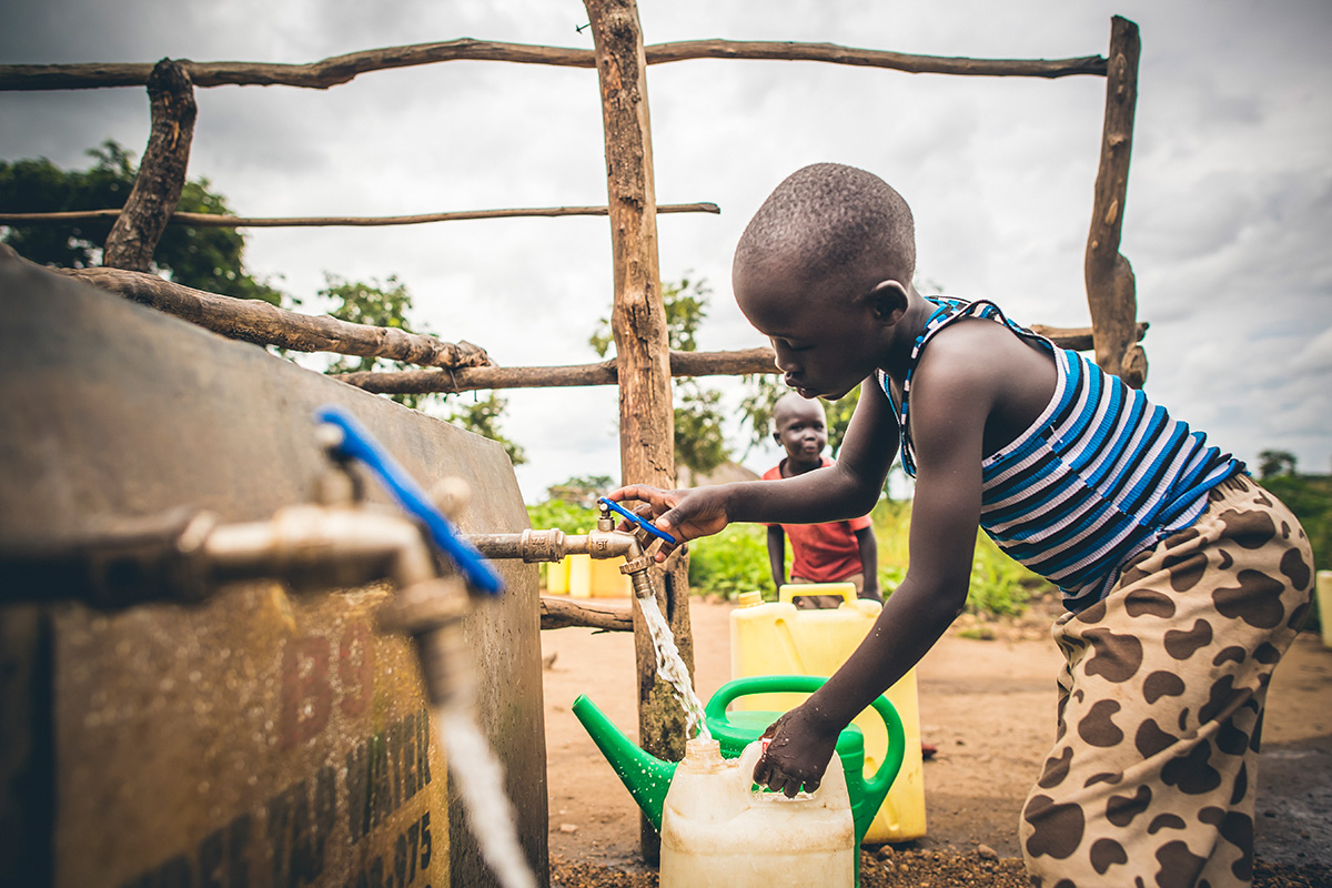 Drawing water from a Water Mission tap!