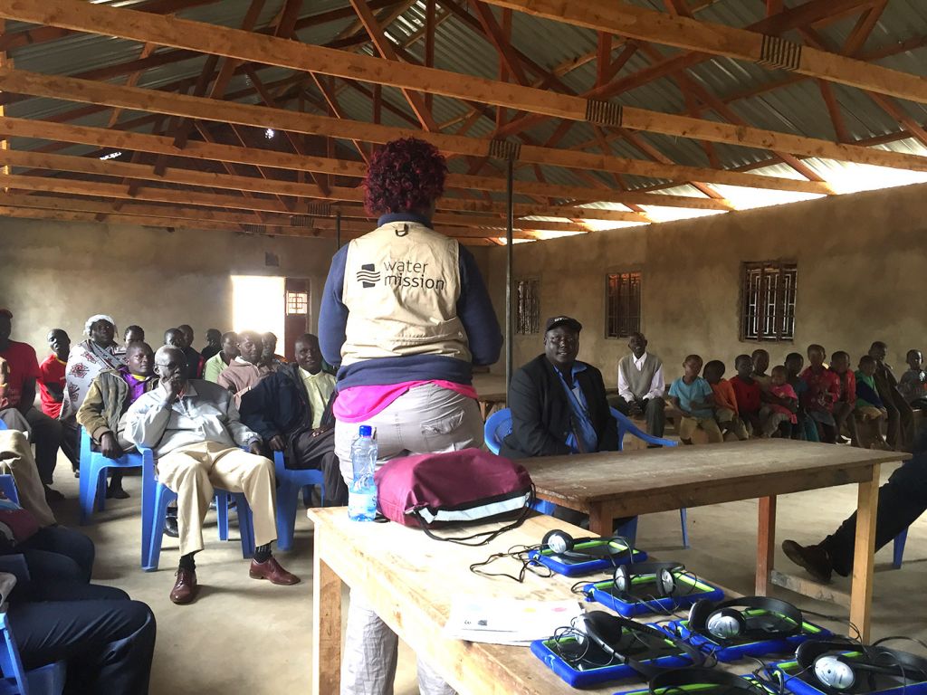 Participants in Kenya learn about the Restore Survey.