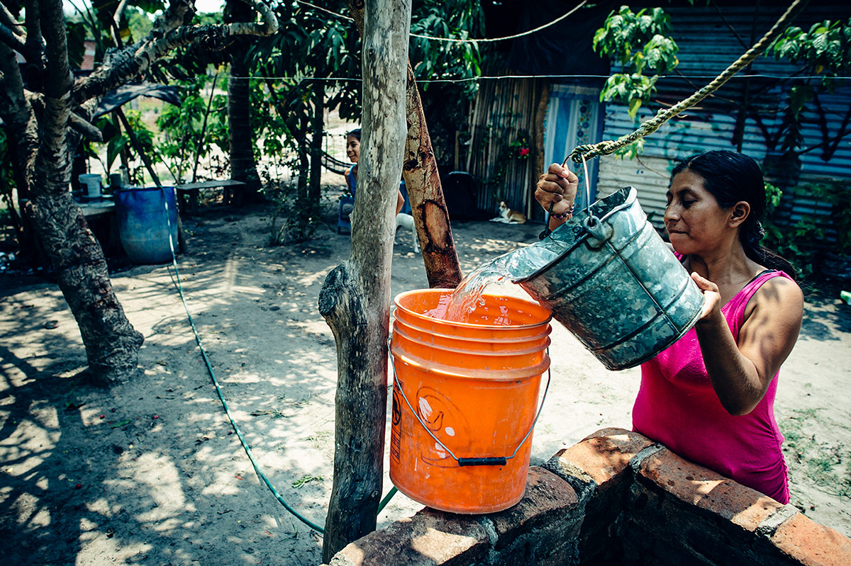 Hortencia draws water for her family