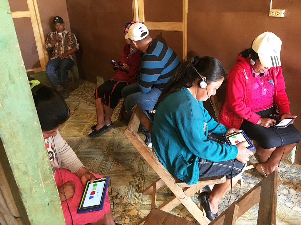 Community members in Honduras take the Restore Survey