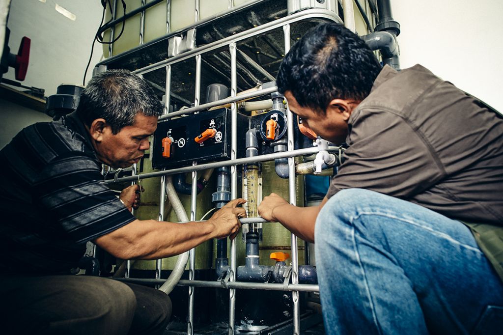 Water Mission Indonesia staff make repairs.