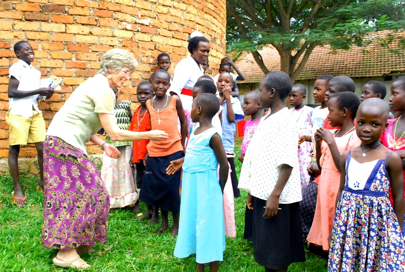 Molly Greene greets children at St. Francis Hospital in Uganda.