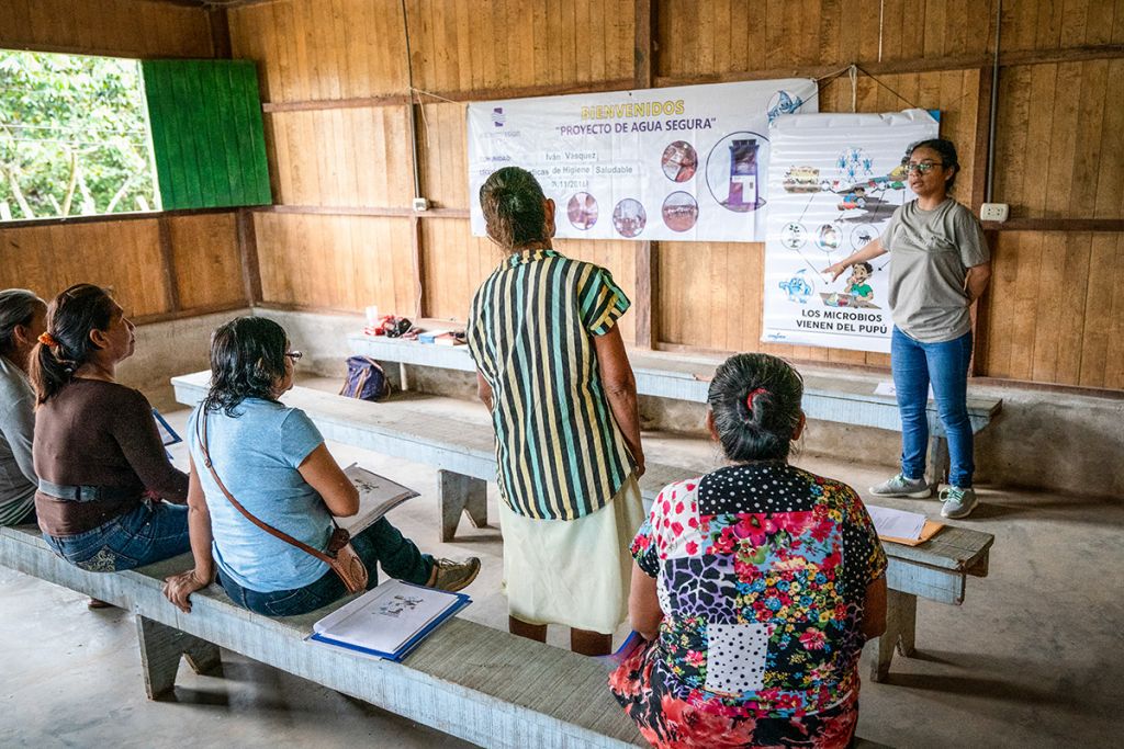Leydi (right, standing) of Water Mission's Peru team trains a group of women as community WASH promoters!