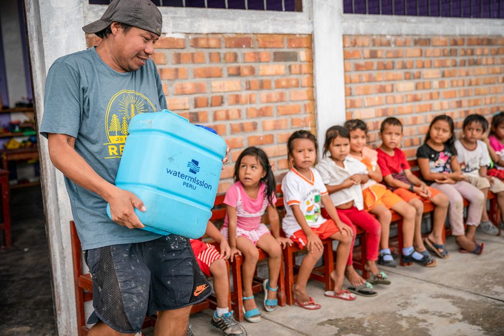 Children at school receiving a safe water delivery