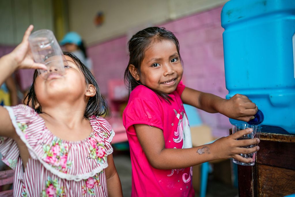 Children in the classroom drinking safe water