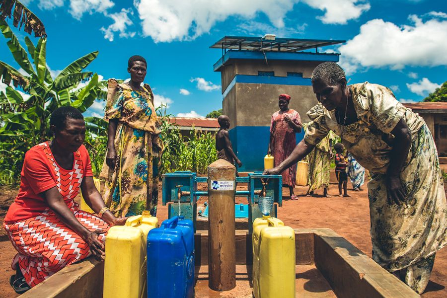 Women at a Water Mission tap stand