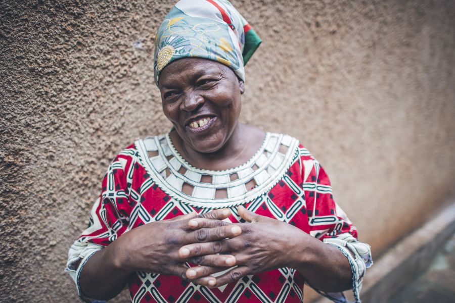 Jaina Iddi Mwenda, 58, Community Health Officer for the government and WASH Coordinator for Water Mission in and around her home. Taken by Sean Sheridan, for Water Mission.