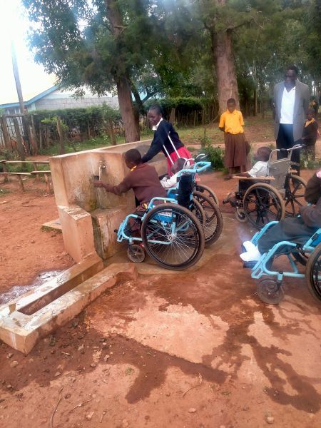 A specially designed faucet allows students in wheelchairs to access water independently.