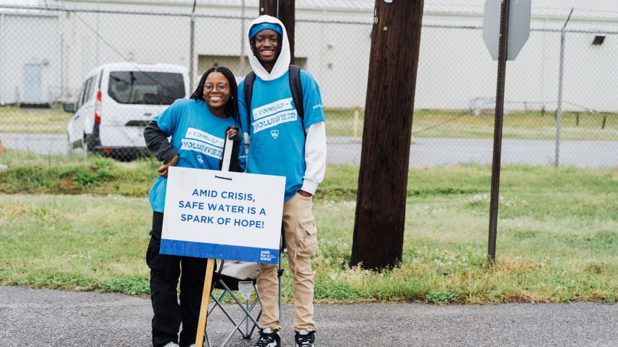 Along the route, volunteers held signs sharing facts and information about the global water crisis. 