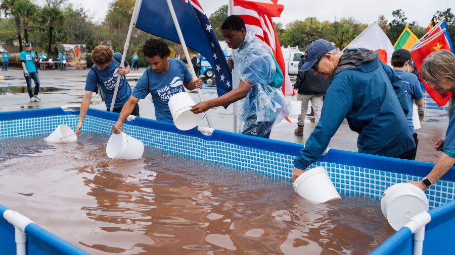 Walkers filled their buckets with dirty water symbolizing the contaminated water many people around the world must use.